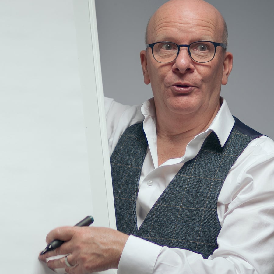 Kevin headshot at whiteboard - edited Nov 2025